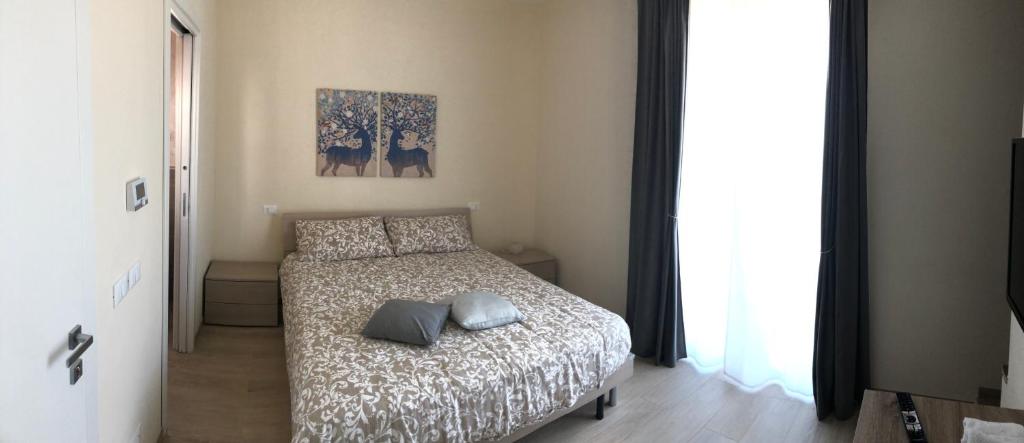 Postel nebo postele na pokoji v ubytování Camere LaVigna di Nardi Maria
