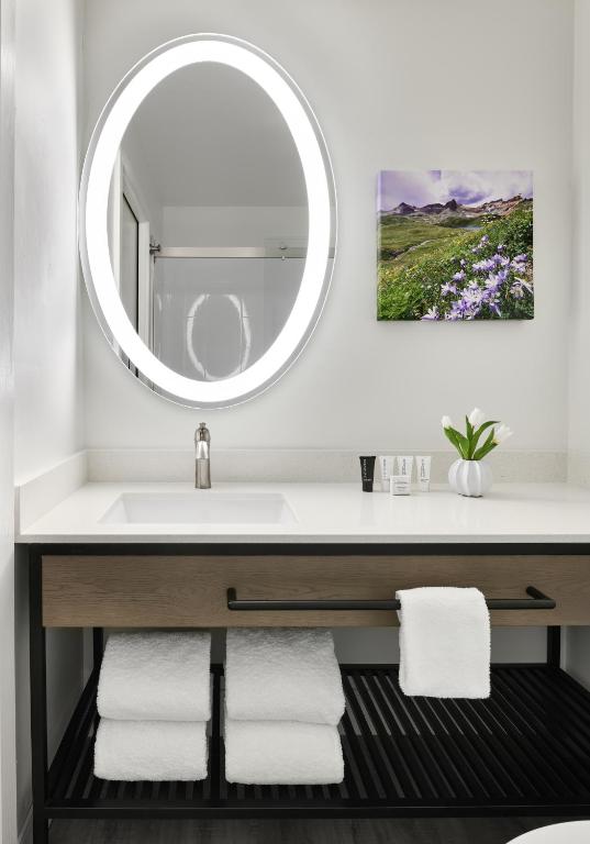 a bathroom with a sink and a mirror at The Inn at Aspen in Aspen