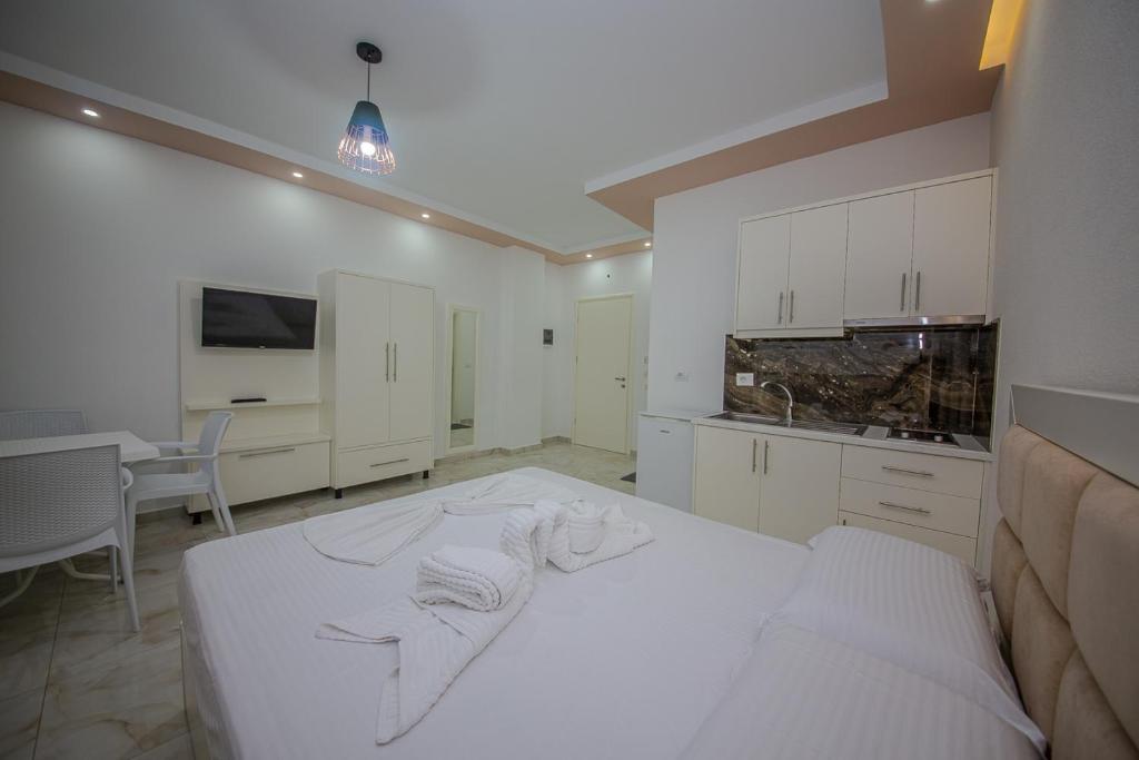 Postel nebo postele na pokoji v ubytování Hotel Landi
