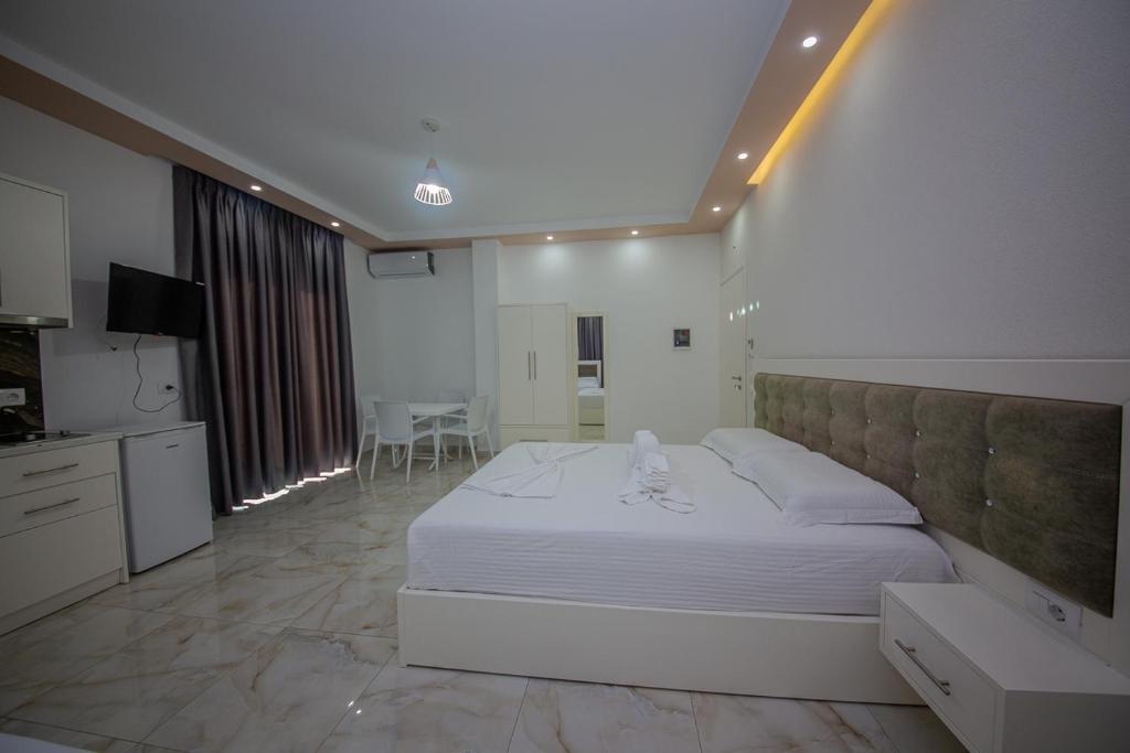 Postel nebo postele na pokoji v ubytování Hotel Landi