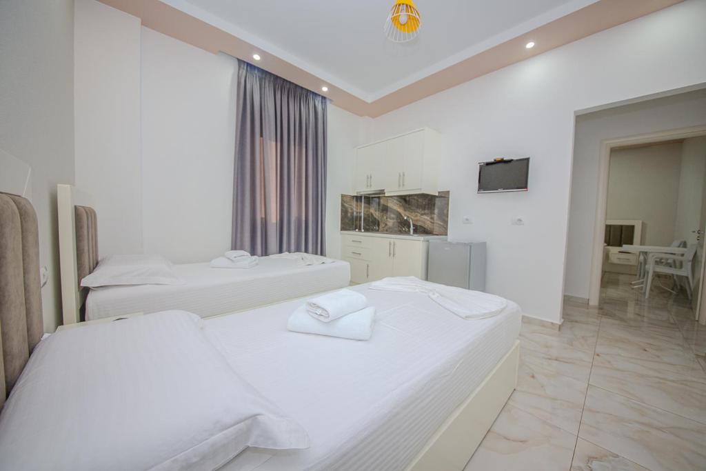Postel nebo postele na pokoji v ubytování Hotel Landi