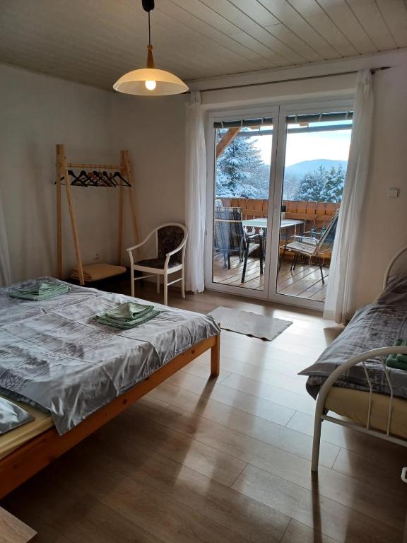 Postel nebo postele na pokoji v ubytování Apartmány Šumava Boubín