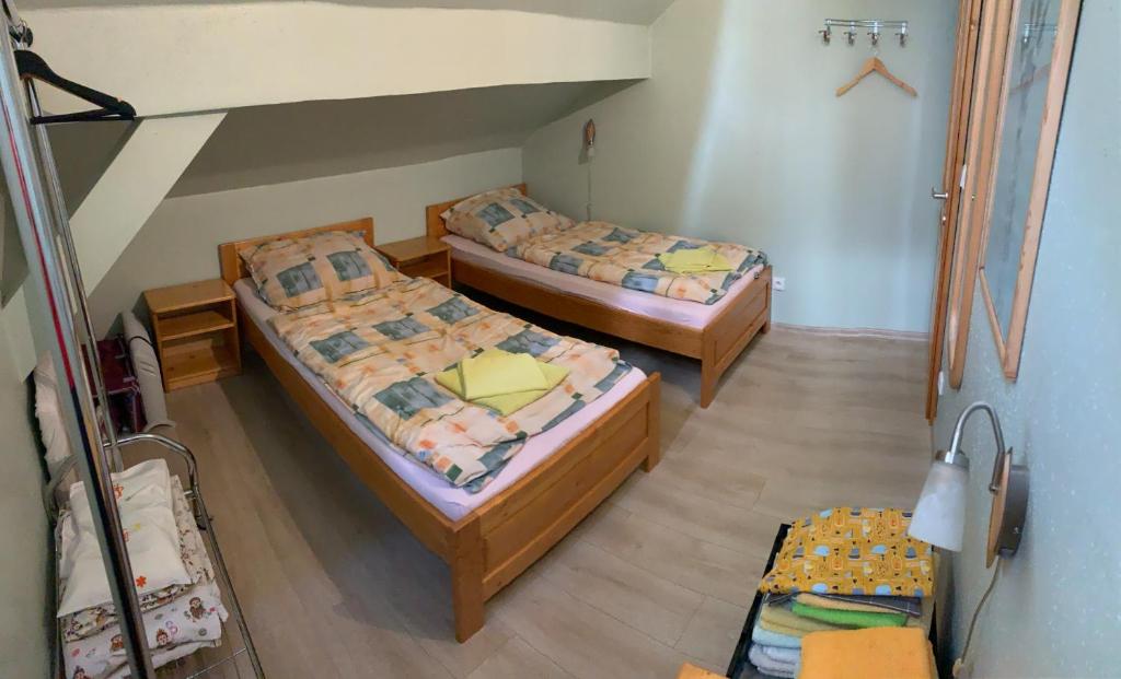 Postel nebo postele na pokoji v ubytování Apartmány Šumava Boubín