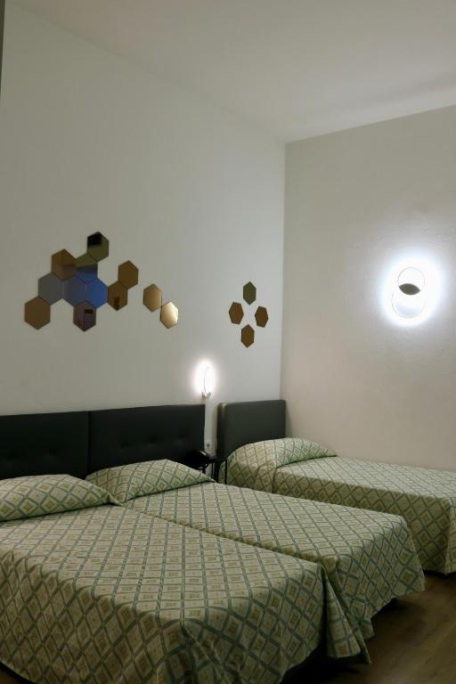 Postel nebo postele na pokoji v ubytování Hotel Europa