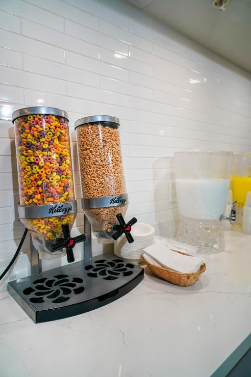 two jars filled with cereal on top of a kitchen counter at West Edmonton Mall Inn in Edmonton