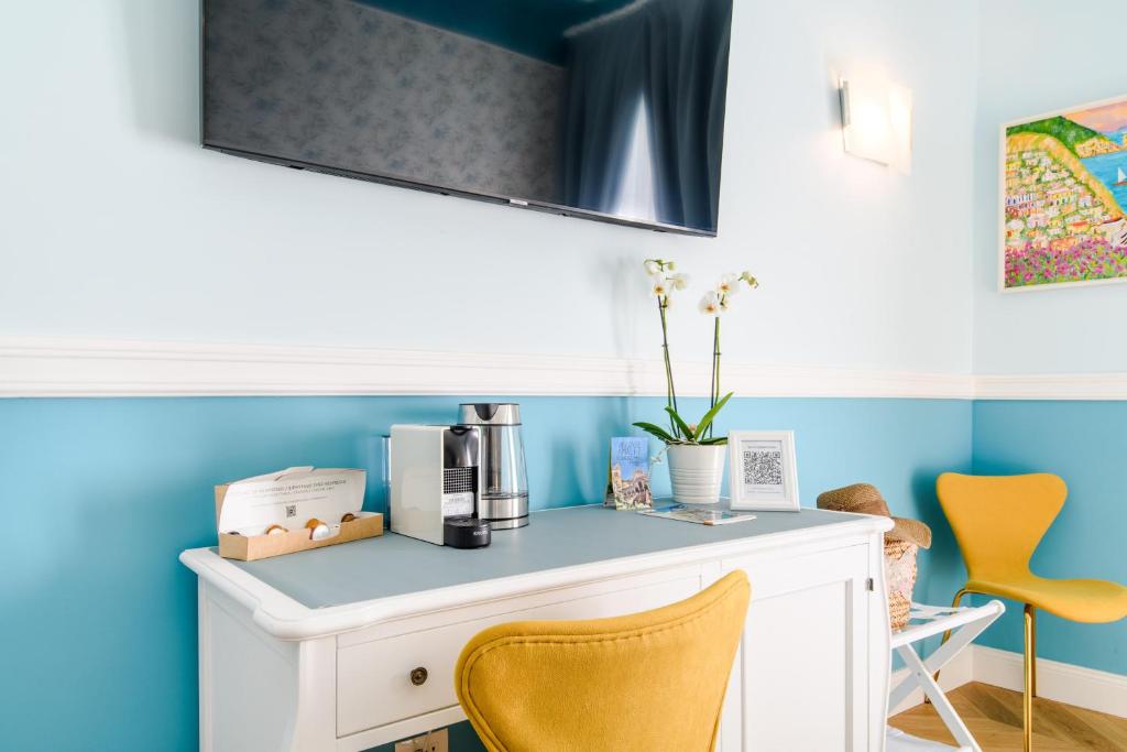 TV a/nebo společenská místnost v ubytování Sirenuse Home & Suites
