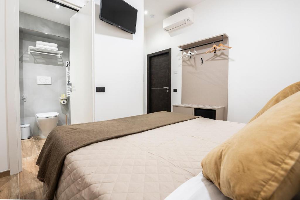 Postel nebo postele na pokoji v ubytování CHD Rooms