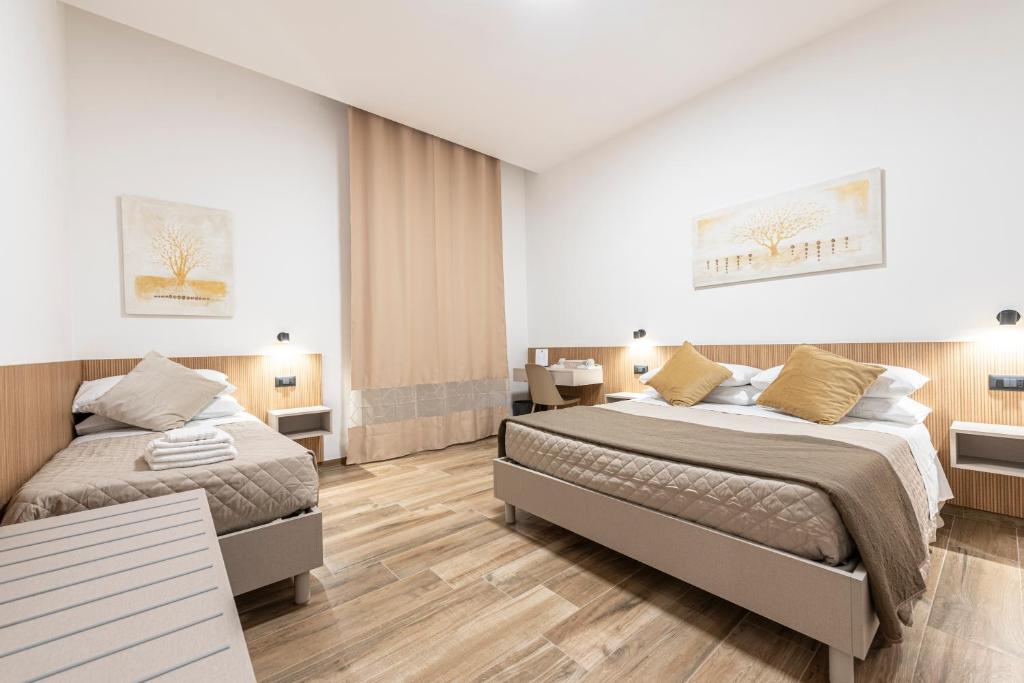 Postel nebo postele na pokoji v ubytování CHD Rooms