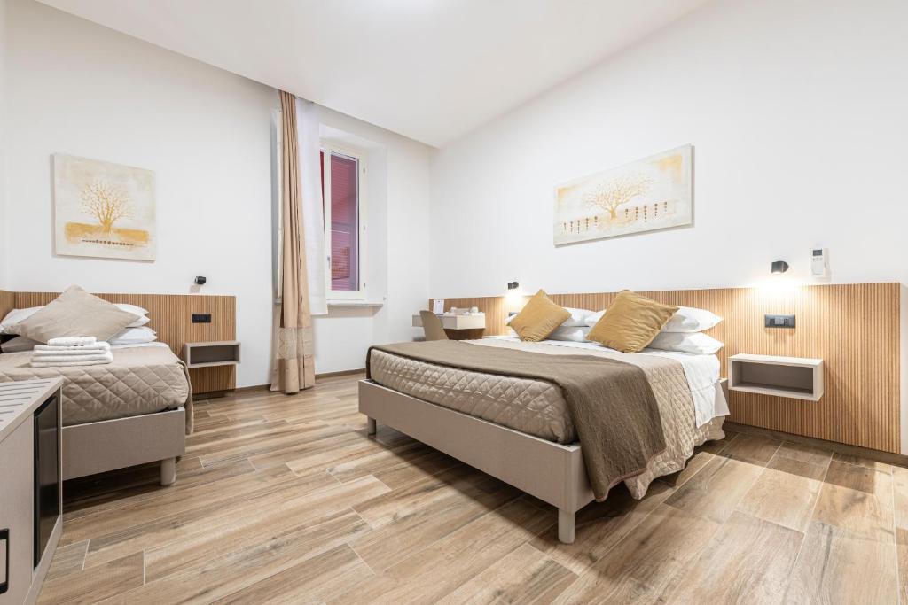 Postel nebo postele na pokoji v ubytování CHD Rooms