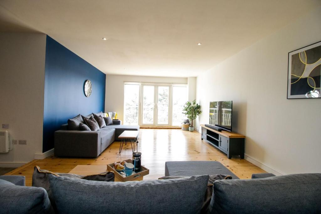 Et opholdsområde på The Penthouse at Bridge Apartments