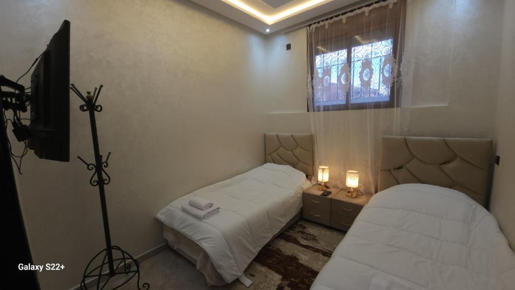 Postel nebo postele na pokoji v ubytování Appartement 7 min de l'aéroport de Marrakech