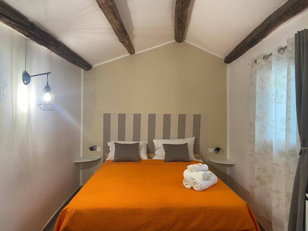 Postel nebo postele na pokoji v ubytování La Piccola Formica Charme Rooms