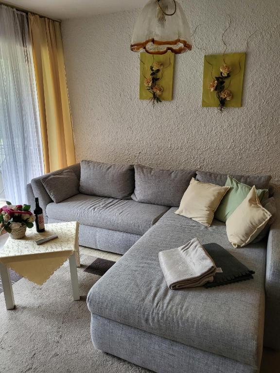 a living room with a couch and a table at Appartment 025 in Tossens in Tossenserdeich