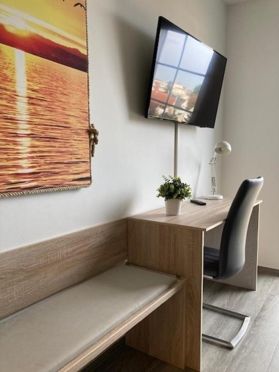 TV a/nebo společenská místnost v ubytování Kabine 7