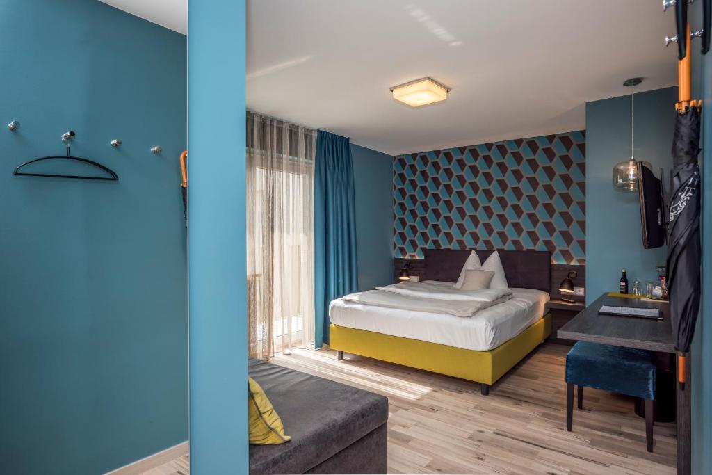 Postel nebo postele na pokoji v ubytování Bavaria Boutique Hotel