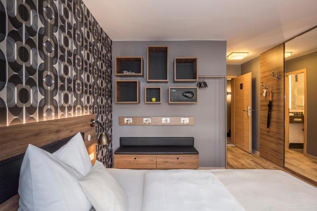 Postel nebo postele na pokoji v ubytování Bavaria Boutique Hotel