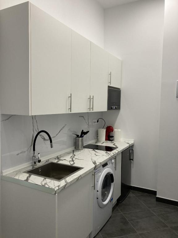 Kuchyň nebo kuchyňský kout v ubytování Ensanche Apartments