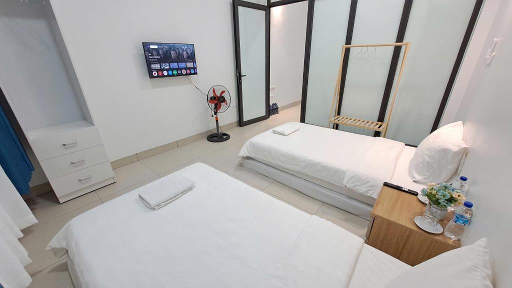 Postel nebo postele na pokoji v ubytování HT Airport Inn