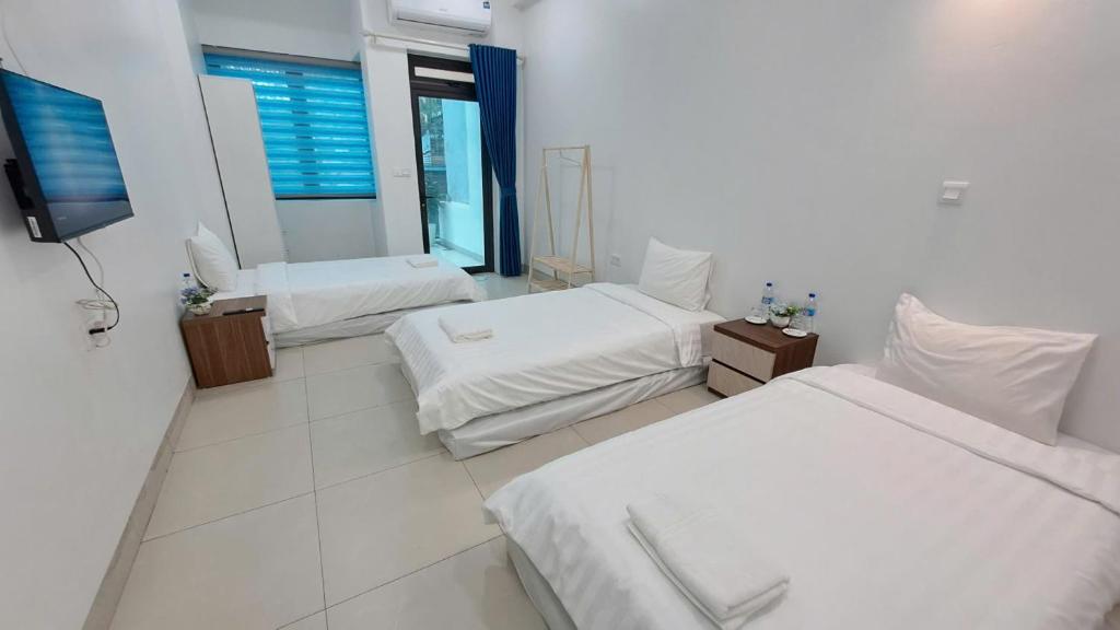 Postel nebo postele na pokoji v ubytování HT Airport Inn