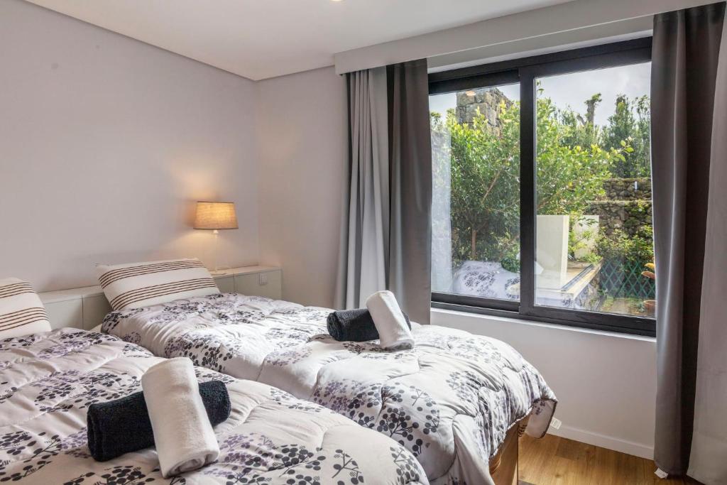 Postel nebo postele na pokoji v ubytování Your Azorean Home RRAL 3378