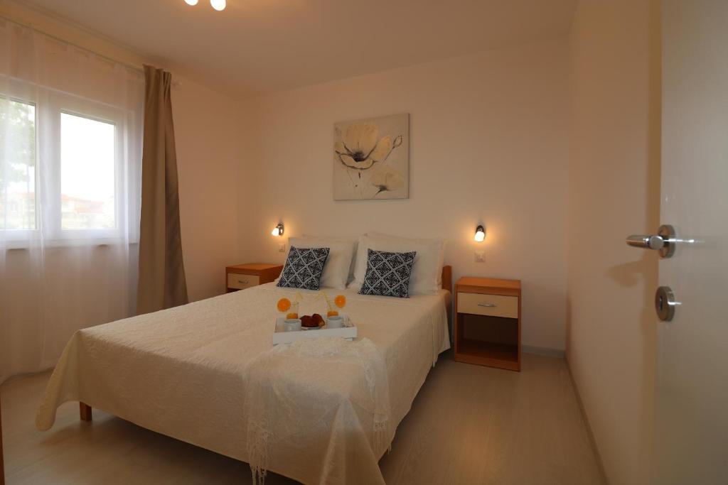 Postel nebo postele na pokoji v ubytování Bungalow Melisa 7
