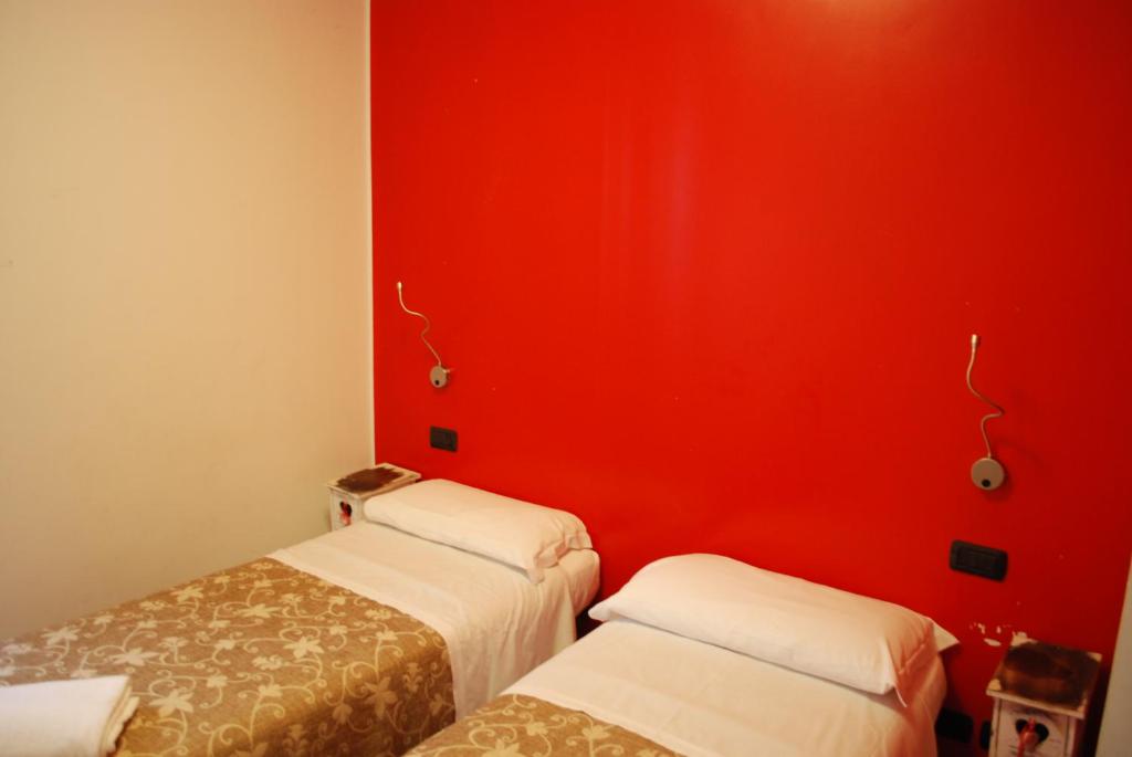 Una cama o camas en una habitación de Hotel San Geremia