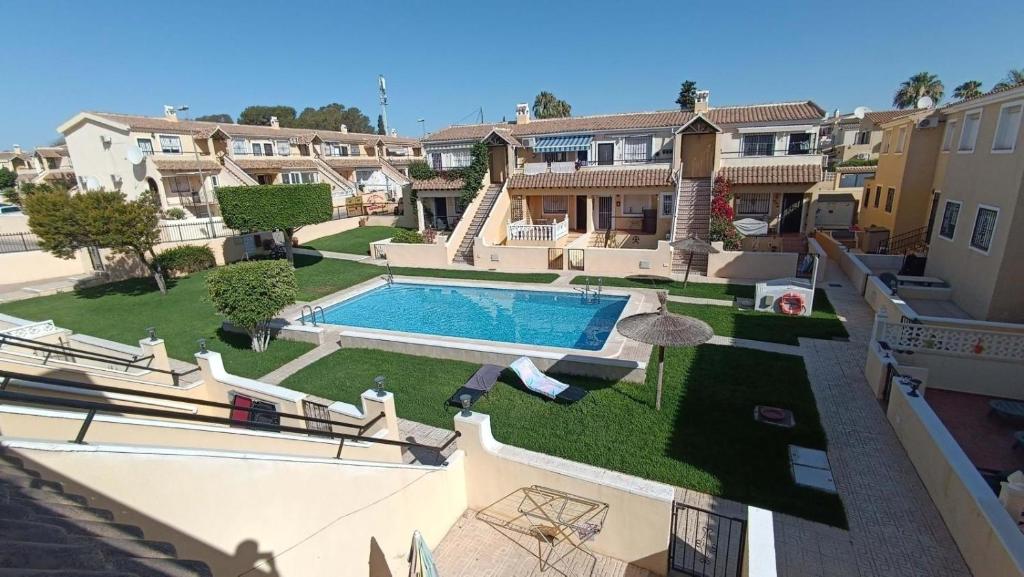 an overhead view of a swimming pool in a yard at La Siesta Perfecta in Villacosta