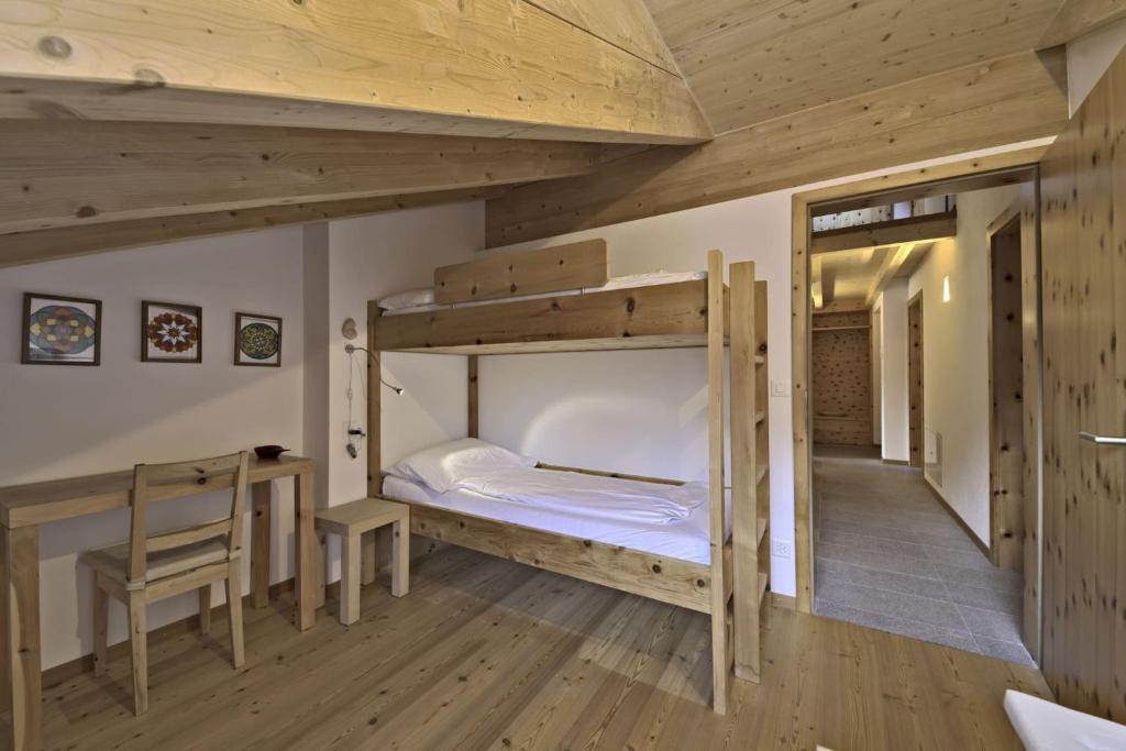 Postel nebo postele na pokoji v ubytování Chesa Piz Chalchagn - Pontresina