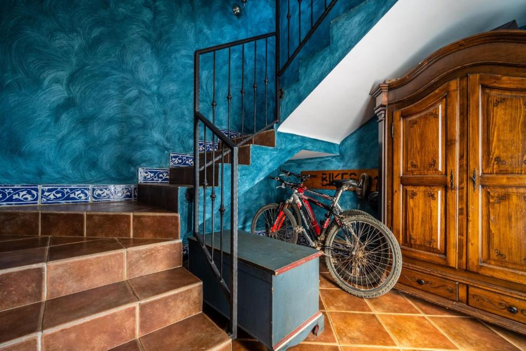 a bike parked next to a staircase in a room at Apartments Oliveto - Calming Sea View in Medulin