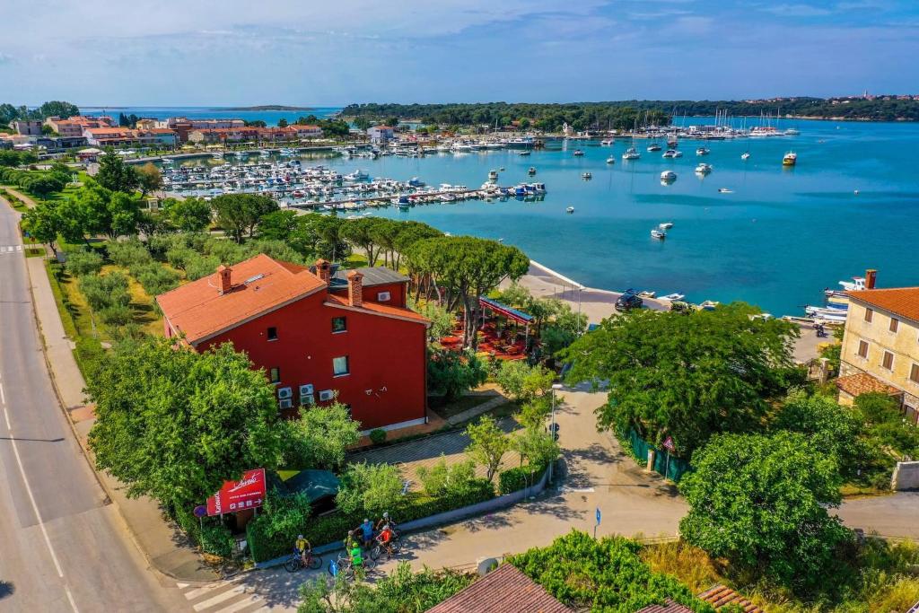 an aerial view of a harbor with boats in the water at Apartments Oliveto - Calming Sea View in Medulin
