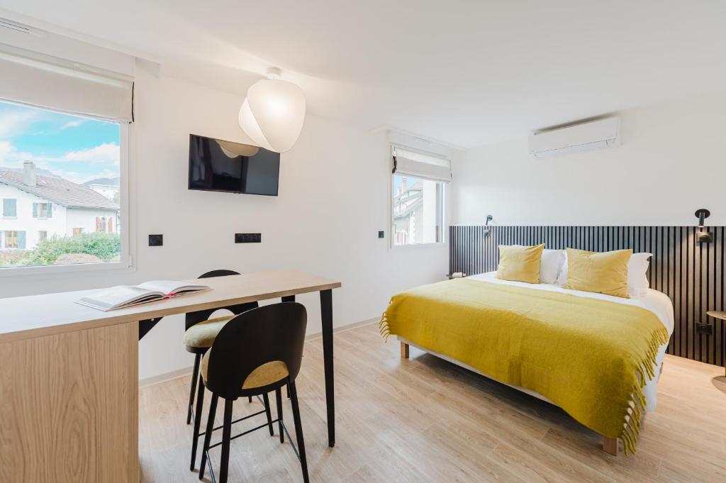 TV a/nebo společenská místnost v ubytování Appart Hotel Neostelia