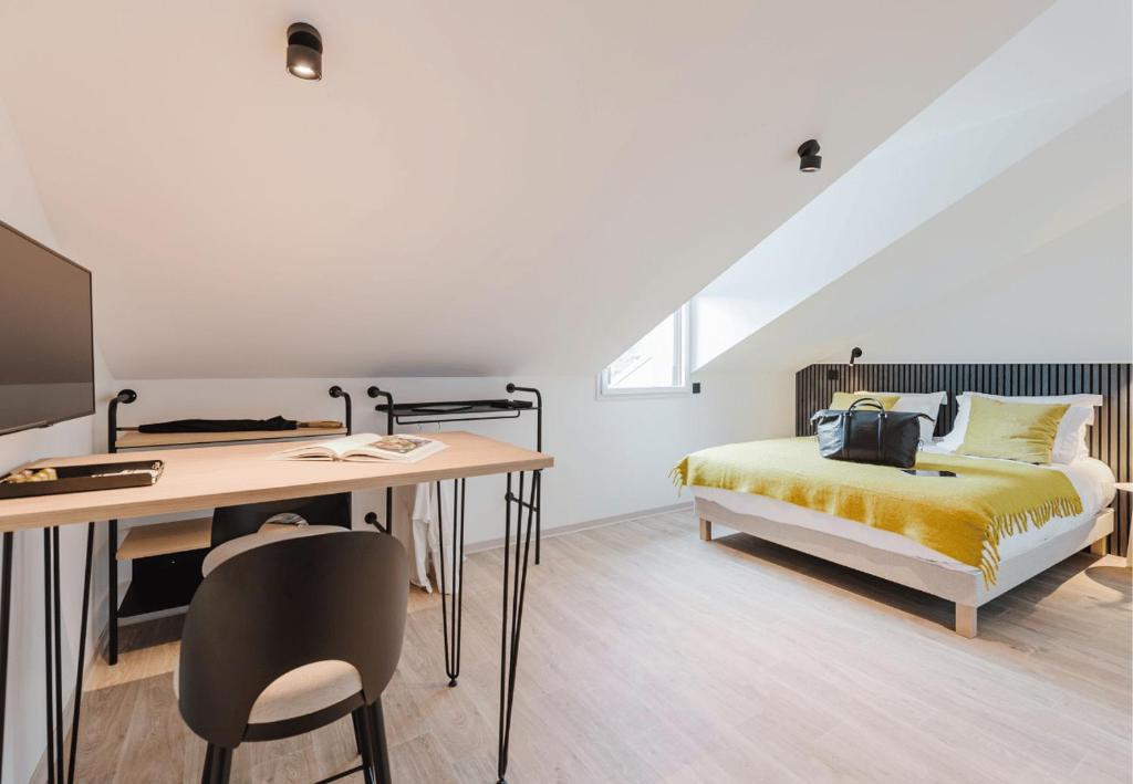 Postel nebo postele na pokoji v ubytování Appart Hotel Neostelia