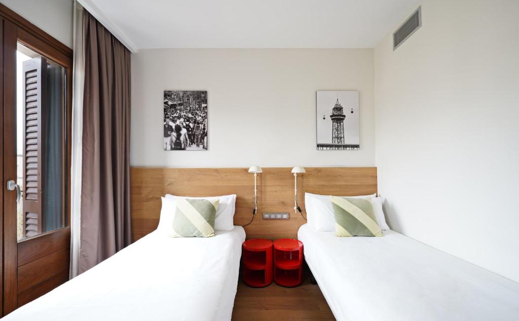 A bed or beds in a room at Ola Living Boqueria