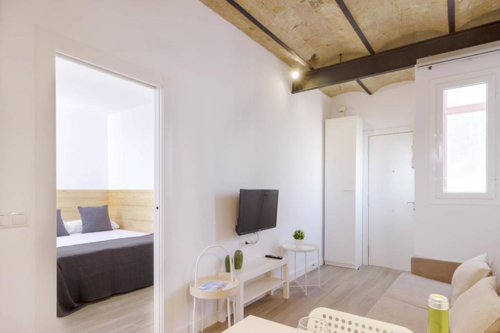 A bed or beds in a room at Ola Living Camp Nou
