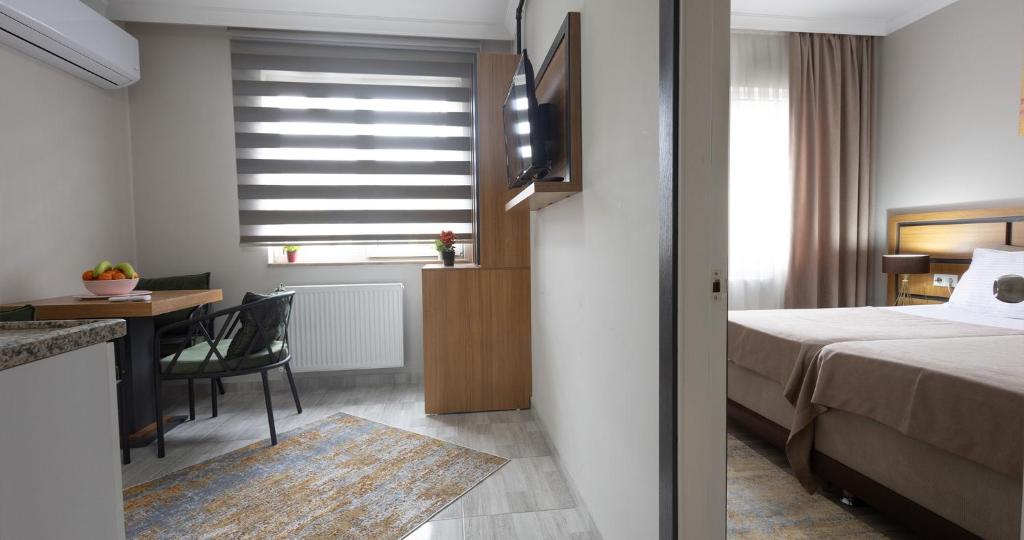 Postel nebo postele na pokoji v ubytování Ayyıldız Pansiyon Apart