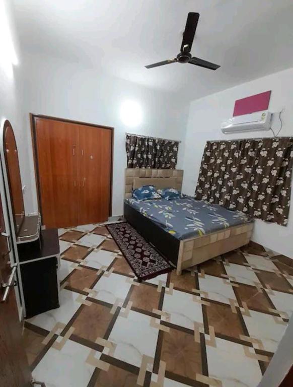 Postel nebo postele na pokoji v ubytování Shivansh Homestay