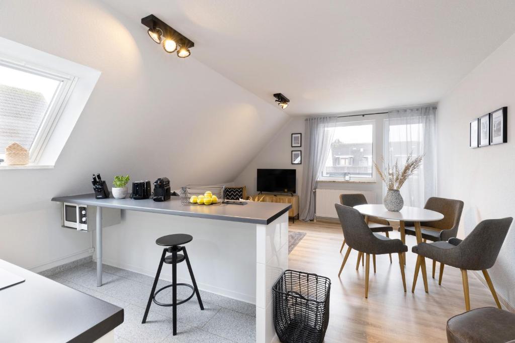 TV a/nebo společenská místnost v ubytování Appartement Tina Kieler Straße 16a APPARTO Grömitz