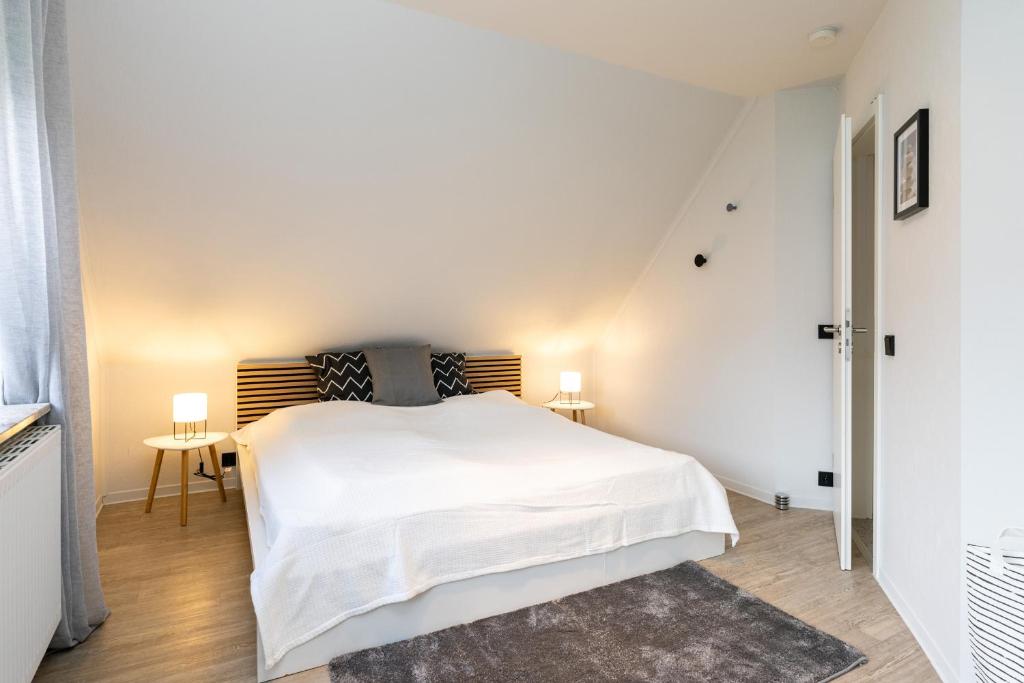 Postel nebo postele na pokoji v ubytování Appartement Tina Kieler Straße 16a APPARTO Grömitz