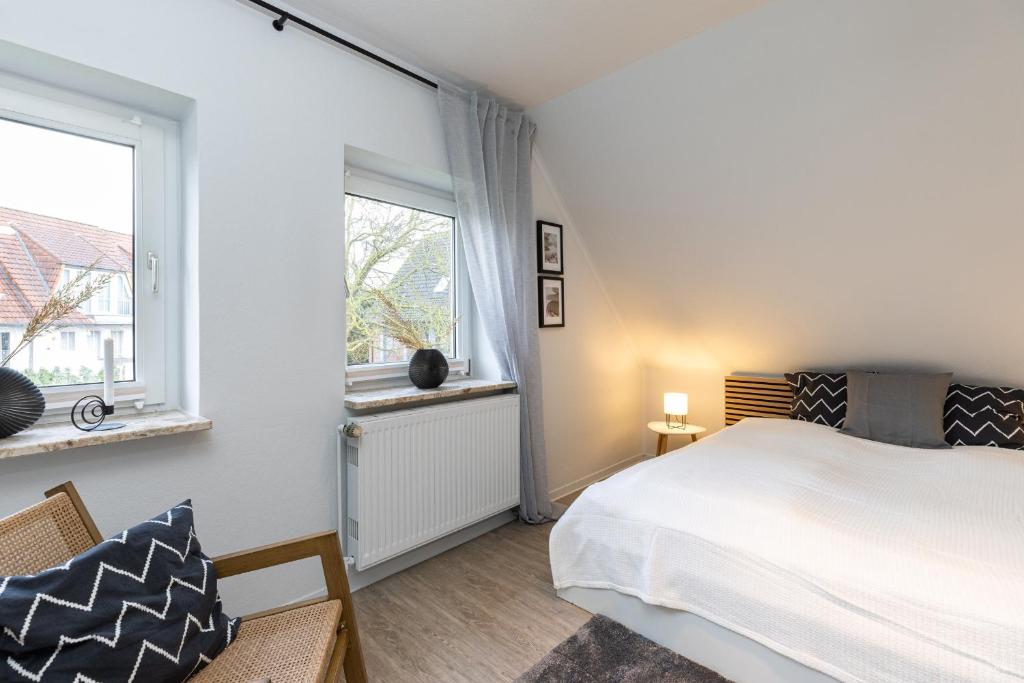 Postel nebo postele na pokoji v ubytování Appartement Tina Kieler Straße 16a APPARTO Grömitz