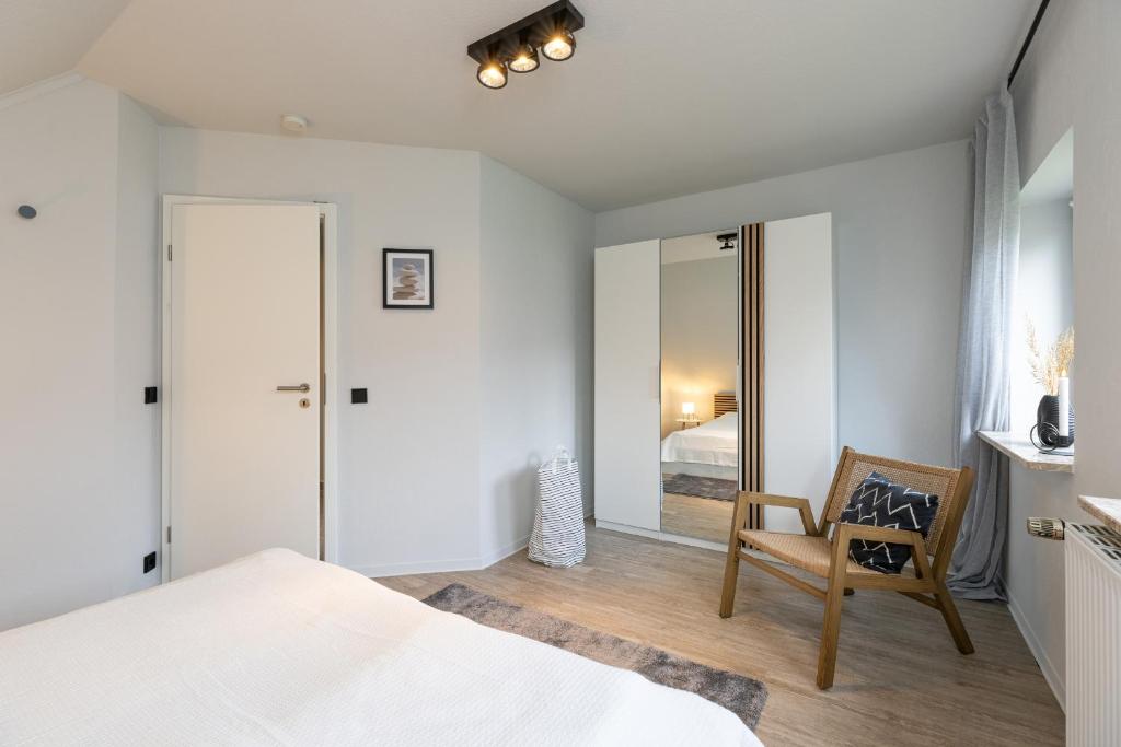 Postel nebo postele na pokoji v ubytování Appartement Tina Kieler Straße 16a APPARTO Grömitz