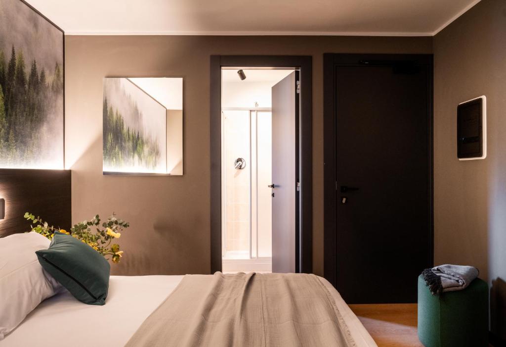 Postel nebo postele na pokoji v ubytování Hotel Due Cime