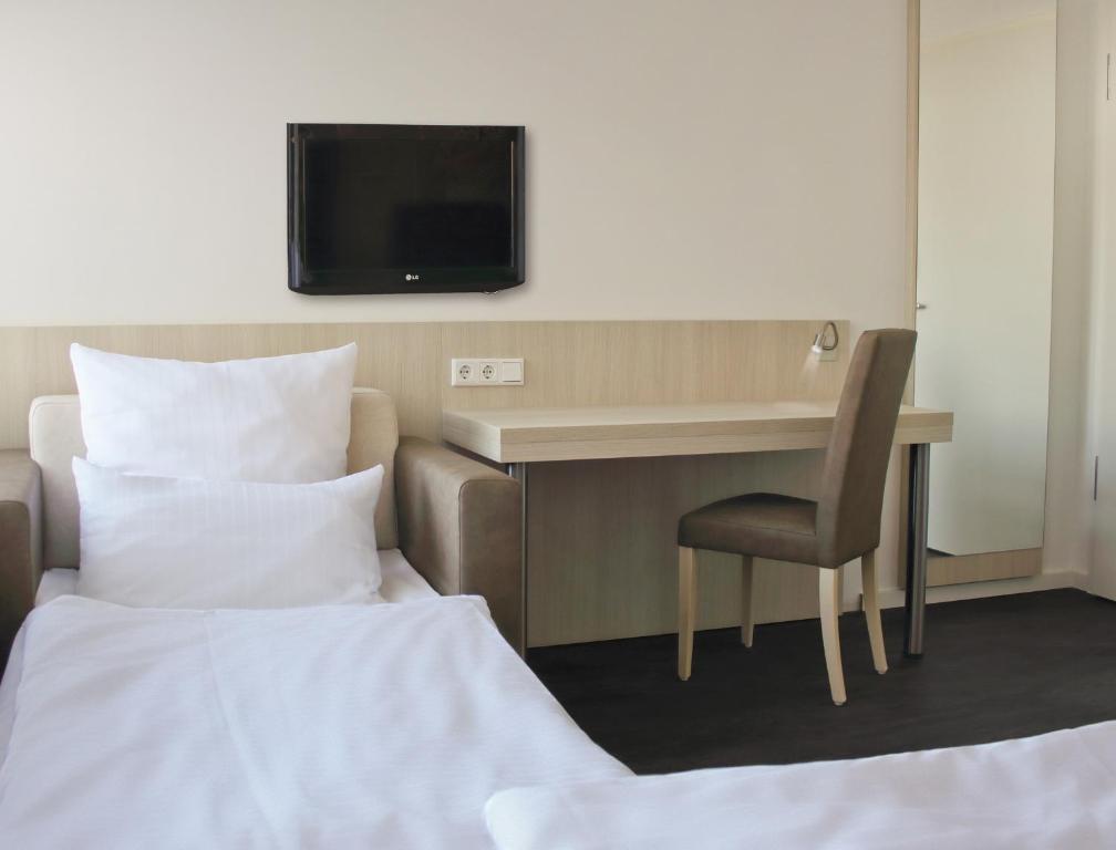 Postel nebo postele na pokoji v ubytování Viva Hotel Lübeck
