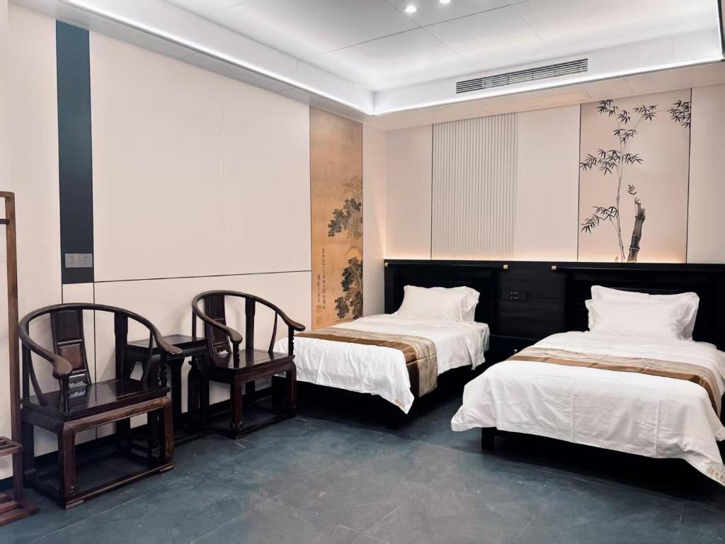 Postel nebo postele na pokoji v ubytování Yongjuxiang Mansion