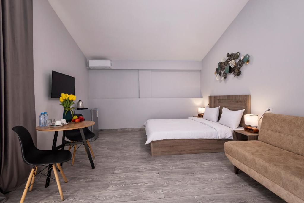 Postel nebo postele na pokoji v ubytování Horizon Hotel Yerevan