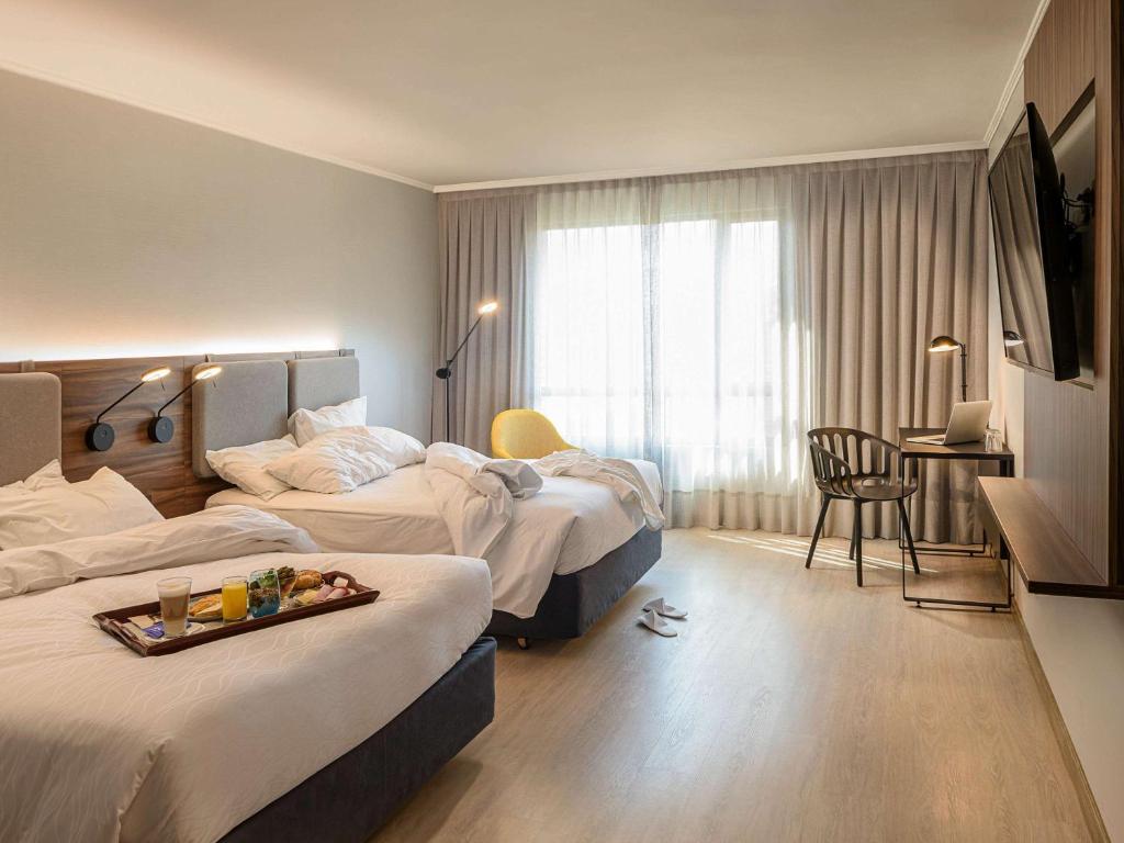 Postel nebo postele na pokoji v ubytování Novotel Santiago Las Condes