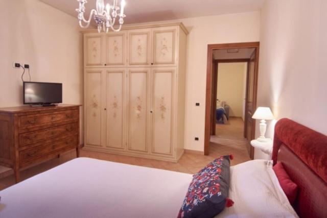 A bed or beds in a room at Alle Porte di Assisi