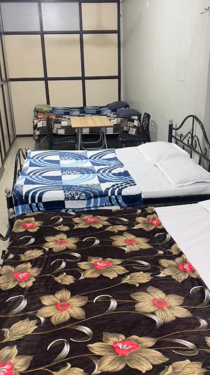Postel nebo postele na pokoji v ubytování Mysuru-hotel