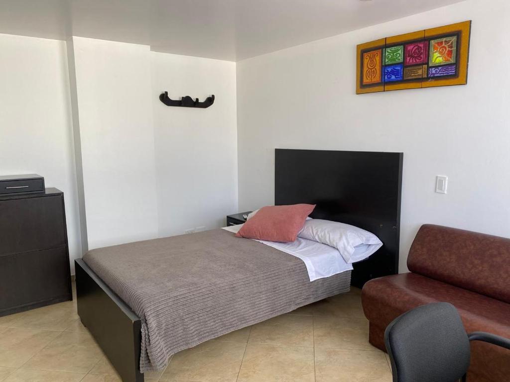 Postel nebo postele na pokoji v ubytování Destino Nómada Calle 11 n 1-38