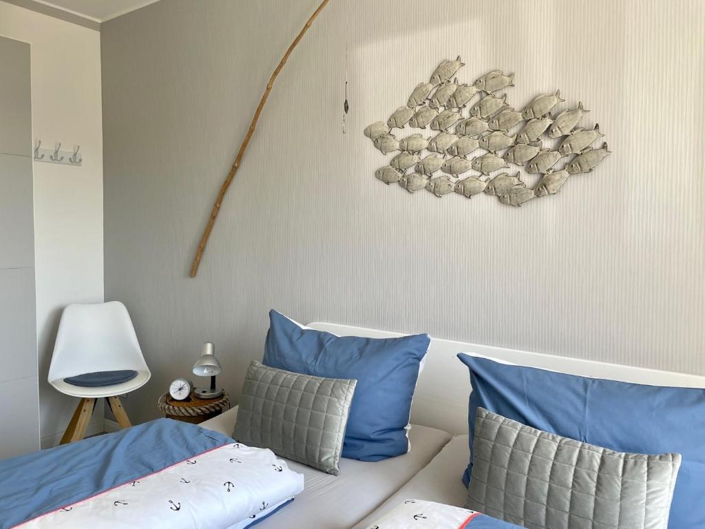 Postel nebo postele na pokoji v ubytování Ferienwohnung Dünennest