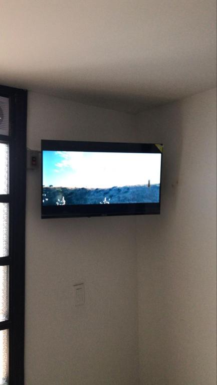TV a/nebo společenská místnost v ubytování Destino Nómada Calle 11 n 1-38